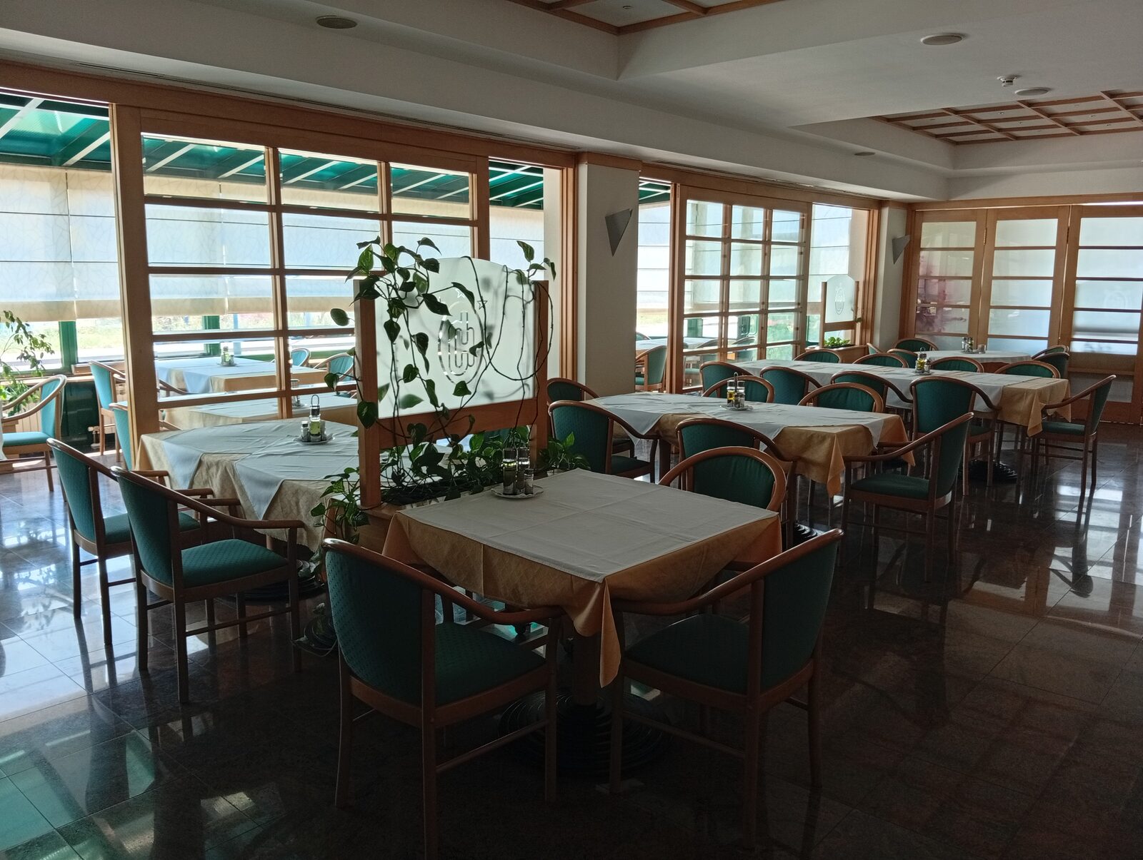 Restaurant dining room with glass conservatory