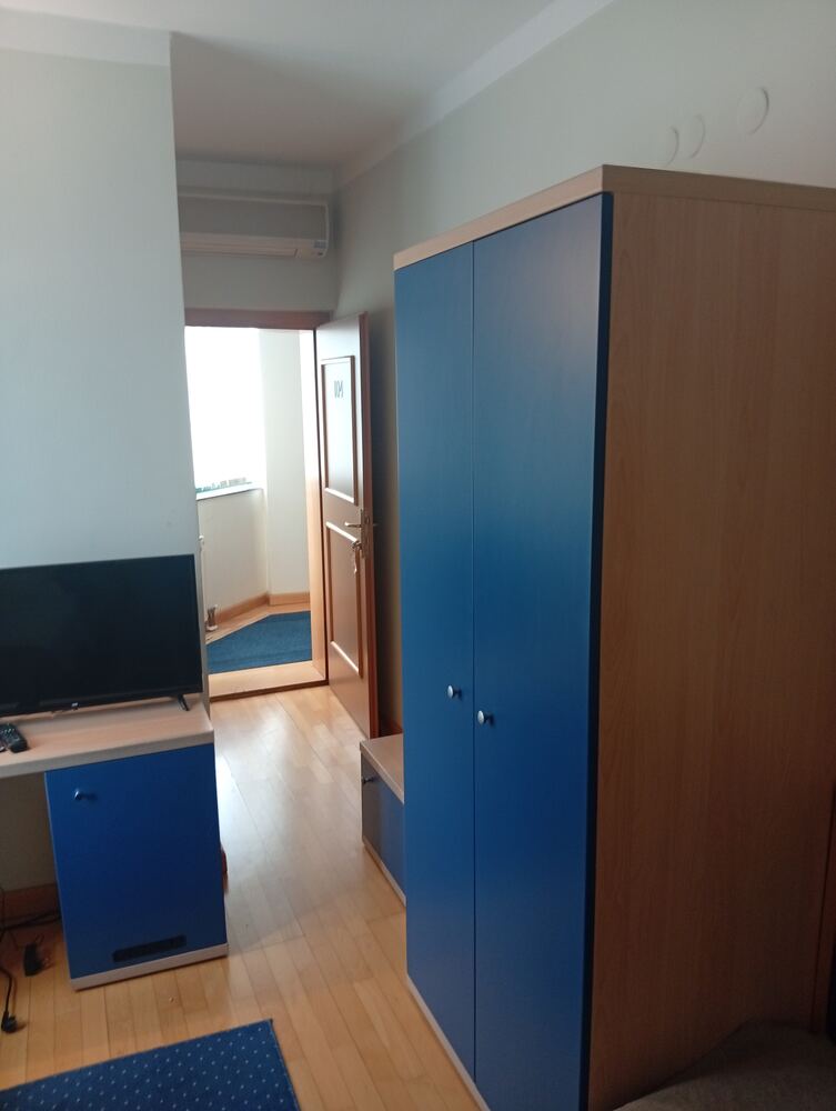 Wardrobe and room view toward the door