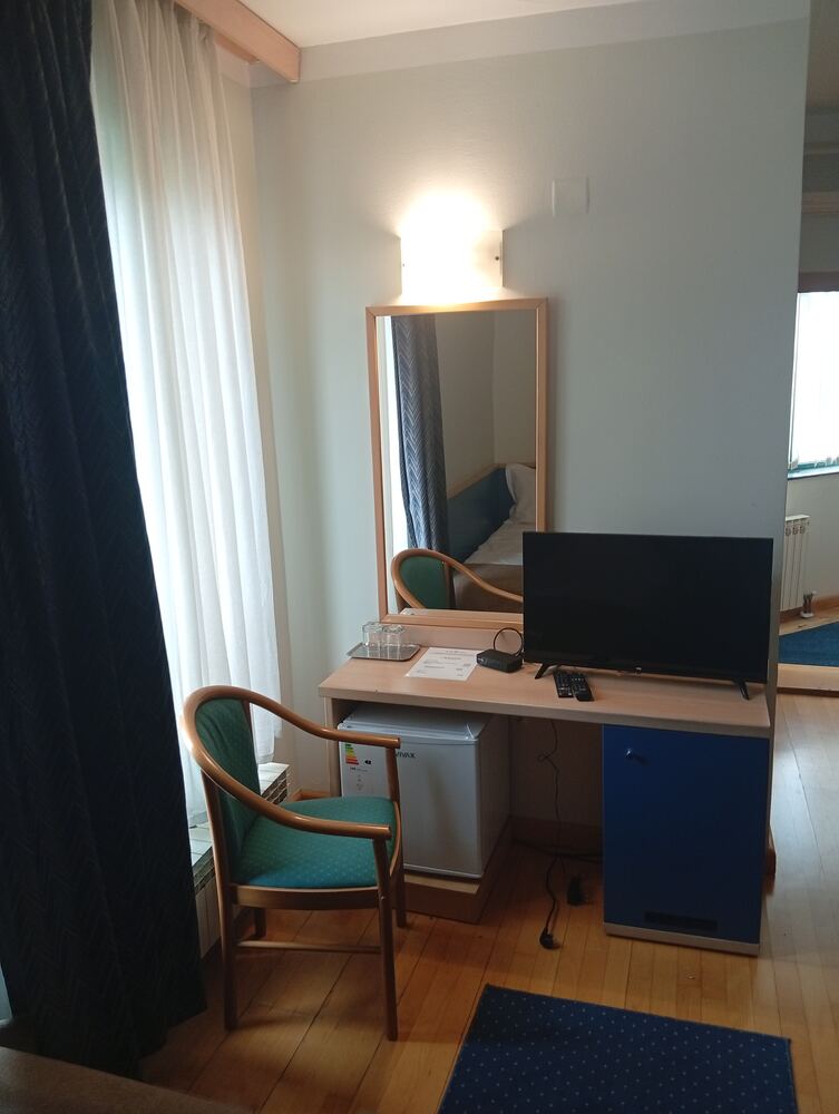 Desk, mirror, flat-screen TV and minibar