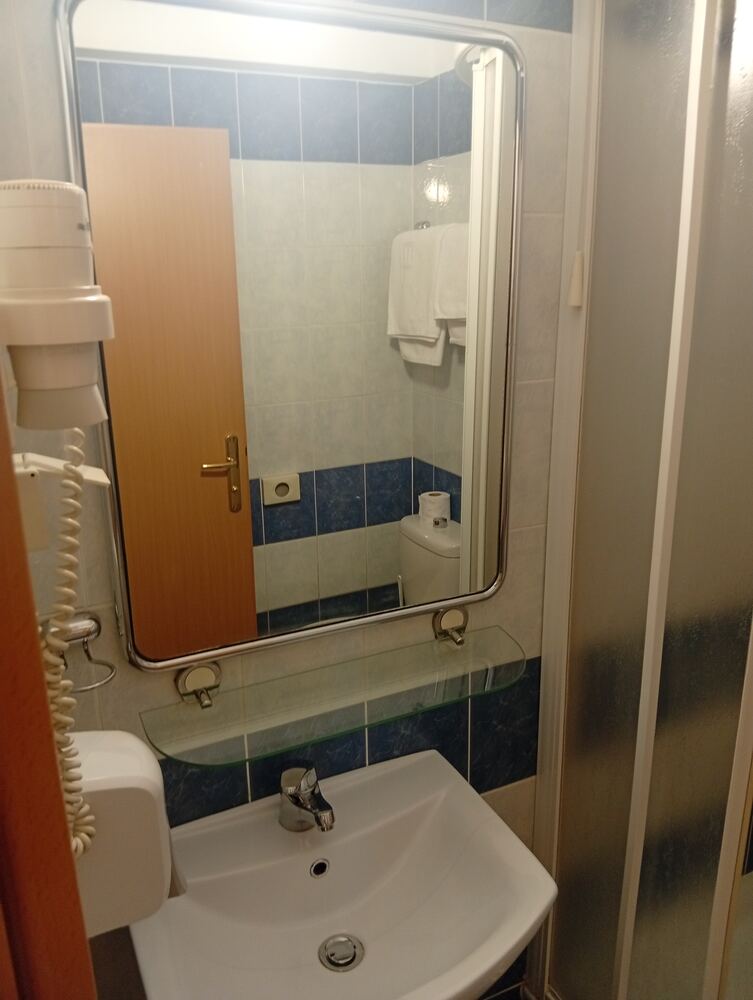 Bathroom sink, mirror and hairdryer