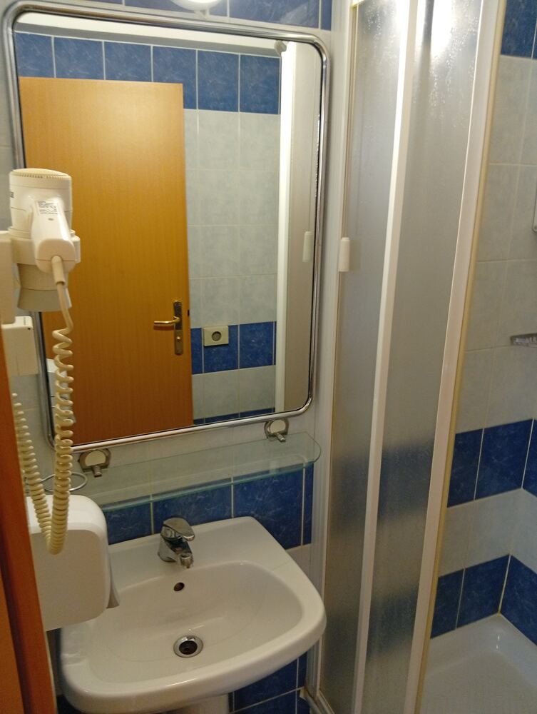 Bathroom sink, mirror and hairdryer